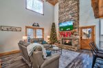 Spacious Living Area on Main Level with 65-inch TV and Gas Fireplace
